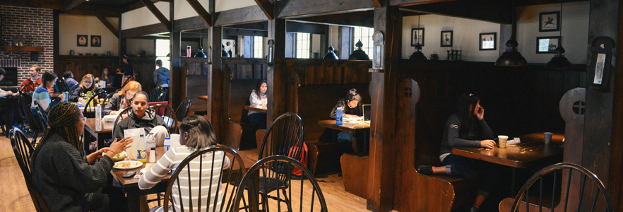 Gordon College students sitting in booths and tables at the Chesters Place, located inside the Lane Student Center.