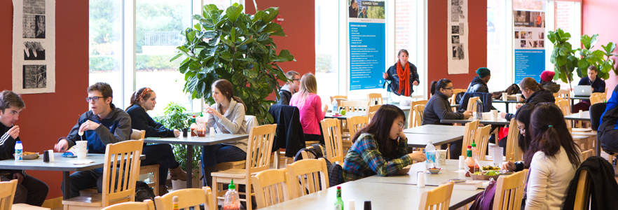 A picture of Gordon College students sitting throughout the dining hall, located inside the Lane Student Center.