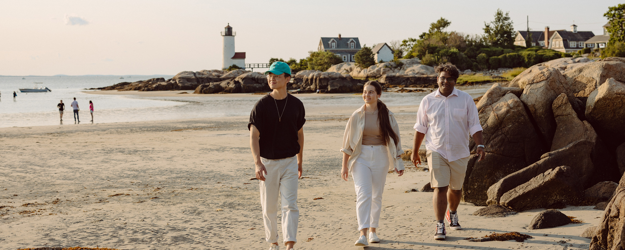 Students walking at the beach