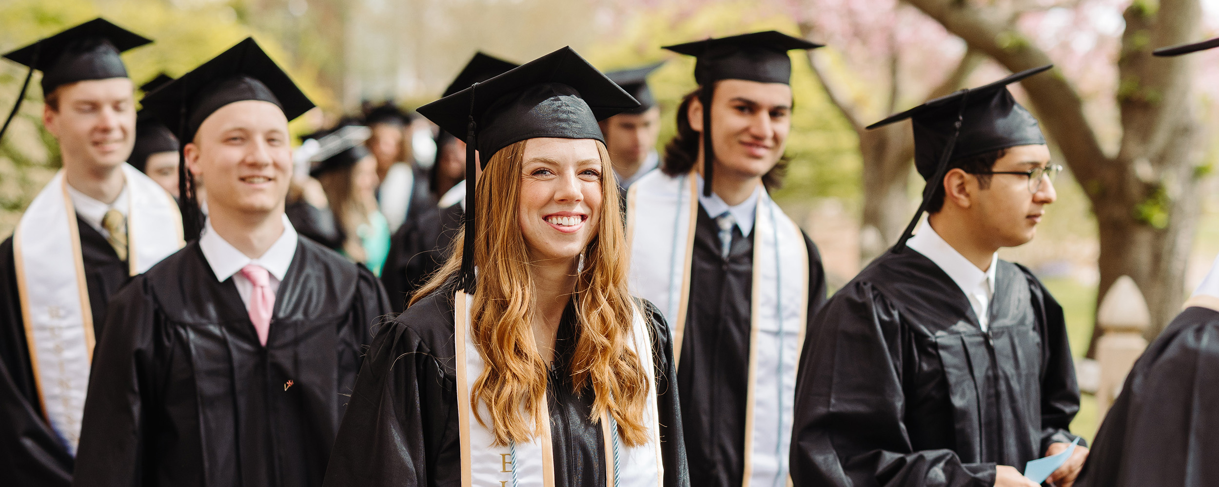 excited friends at graduation