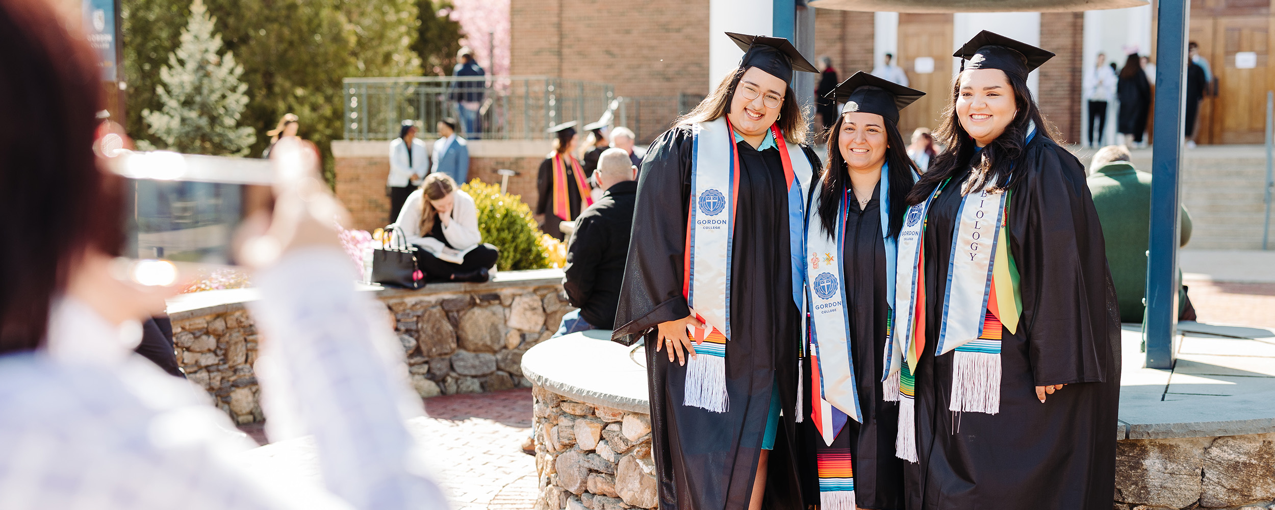 graduates pose for photo