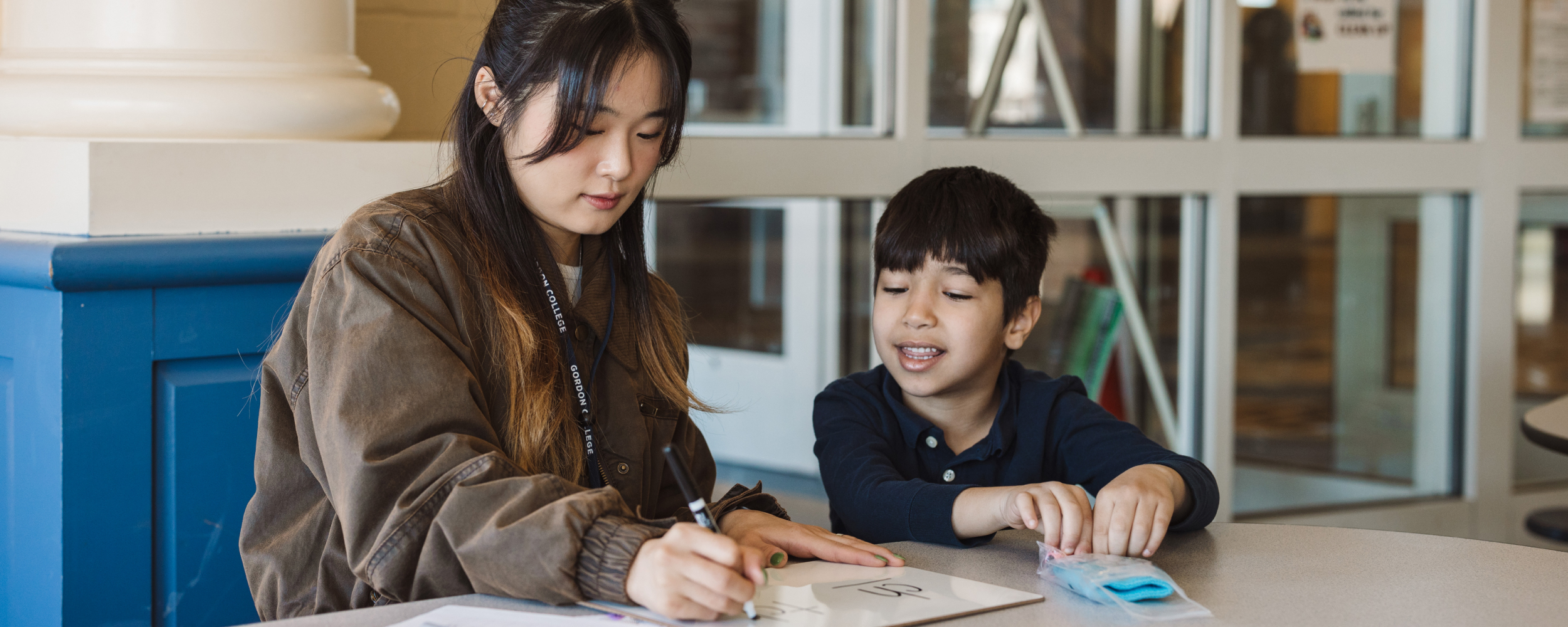 Teacher instructing student